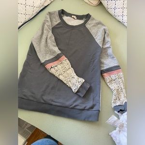 Gray sweatshirt with detailed arms